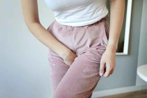 woman running for the toilet because of urinary incontinence Kensal Town